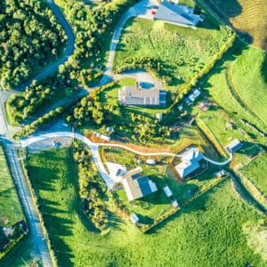 Aerial view on a farmland with roads and small houses. Taranaki
