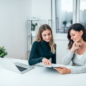 Two casual business women at work.