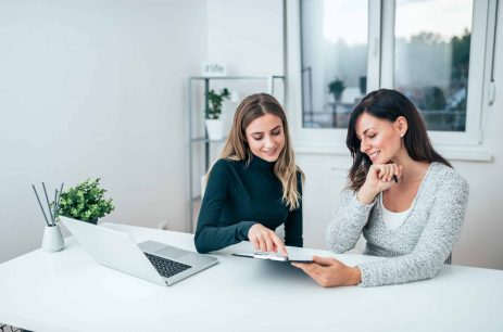 Two casual business women at work. Two casual business women at work.
