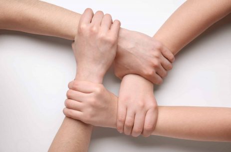 People holding hands together on white background. Unity concept People holding hands together on white background. Unity concept